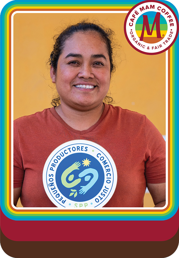 Woman wearing a red shirt with a logo, standing against a yellow background with a Cafe Mam Coffee logo.