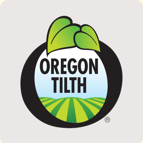 Oregon Tilth logo with green leaves and a field design on a light gray background