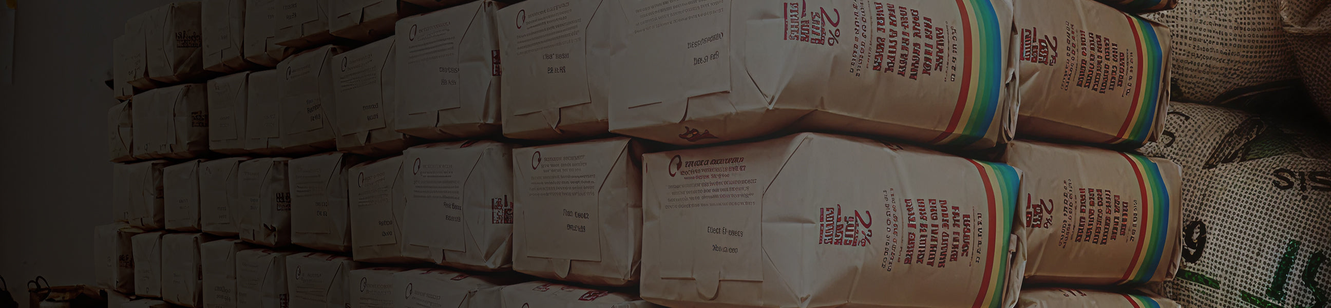 Stack of brown paper bags with visible text and numbers on a dark background